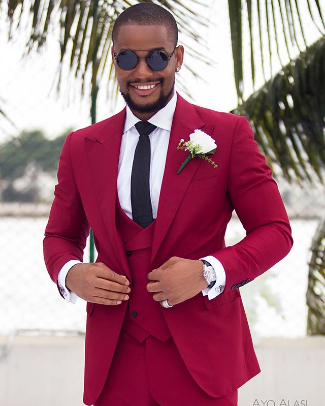 Alex Ekubo red suit