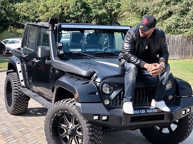 Bolanle Ninalowo all swag with a jeep