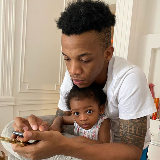 Tekno having a selfie with cute baby girl 