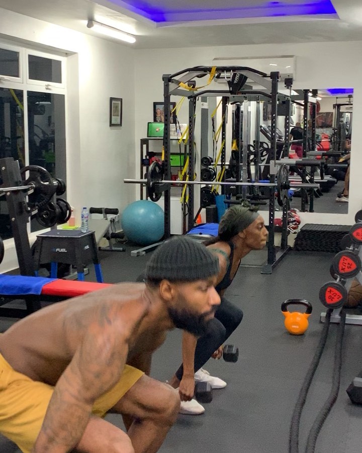 Mike and wife doing a workout at the gym 